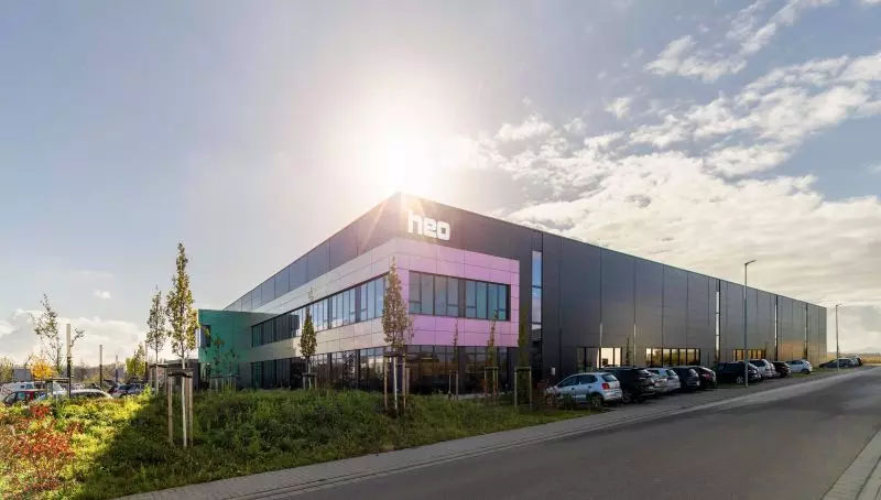 photo of the heo campus during daytime with cars parking in the front in 2021