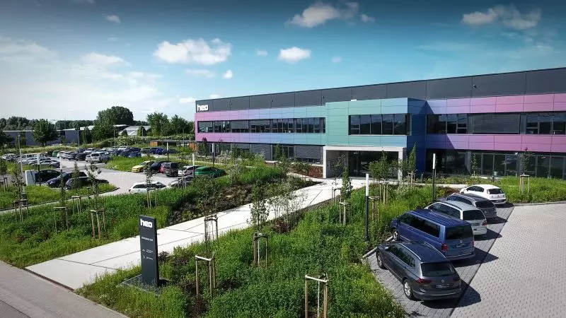 photo of the heo campus side view with parking lot in 2021