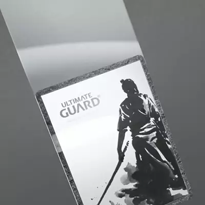 Photo Inserting the card top-first into inner sleeve of premium Katana Sleeve by Ultimate Guard