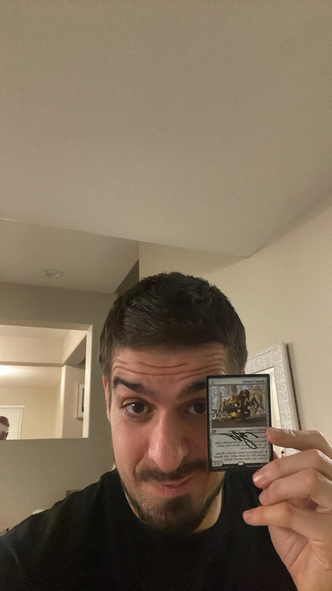 Javier Dominguez holding up signed Bomat Couriers Card