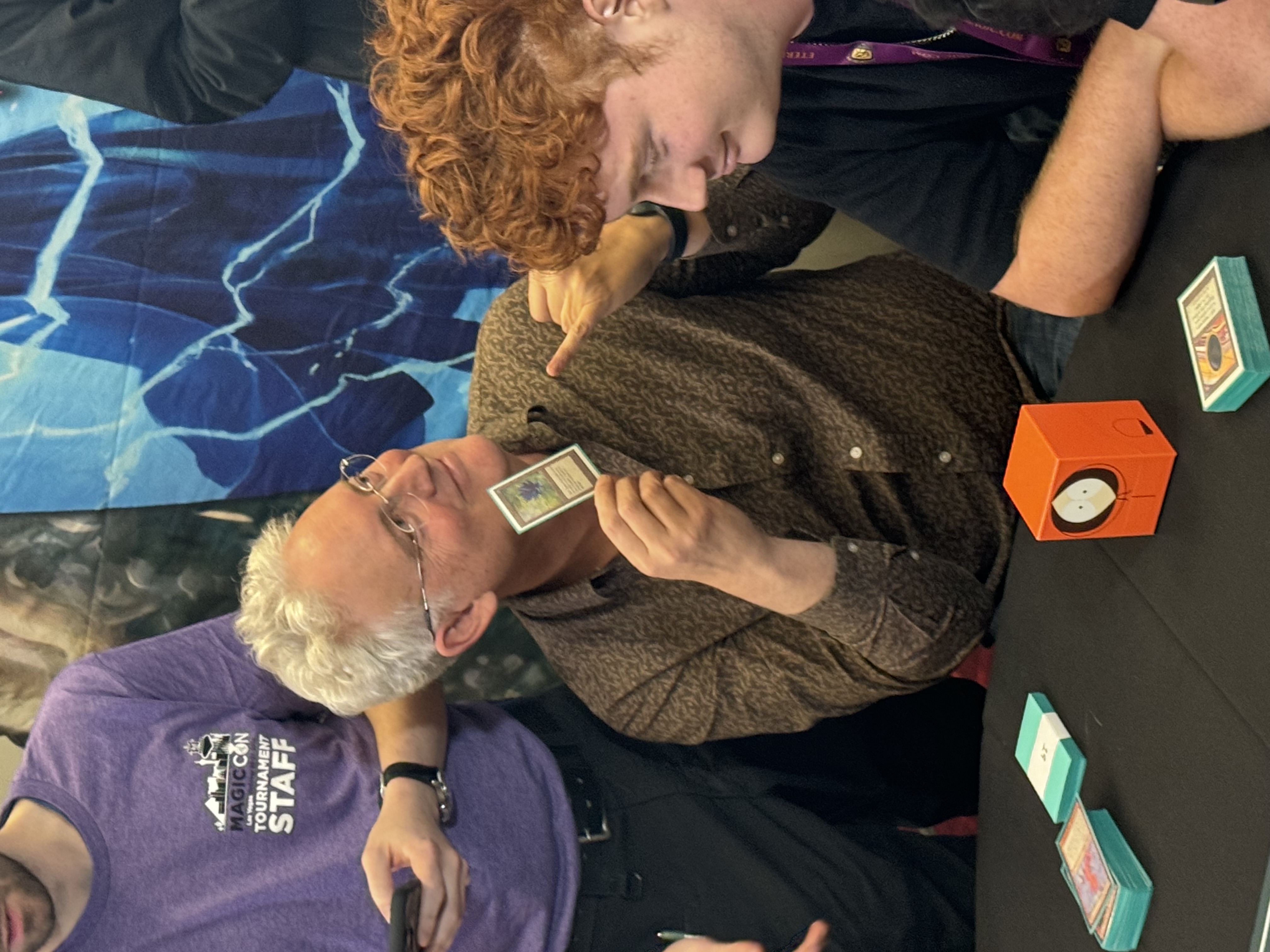 Rex Jakobovits holding up the iconic Black Lotus at The Magic Online Vintage Cube Live Powered By Ultimate Guard event in 2024