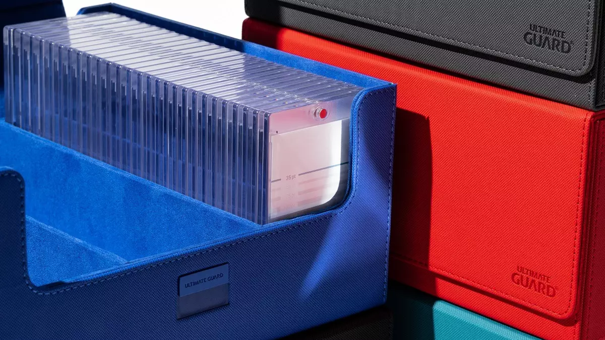 Ultimate Guard's Treasurehive 90+ in the colors blue, red and black storing Magnetic Card Cases