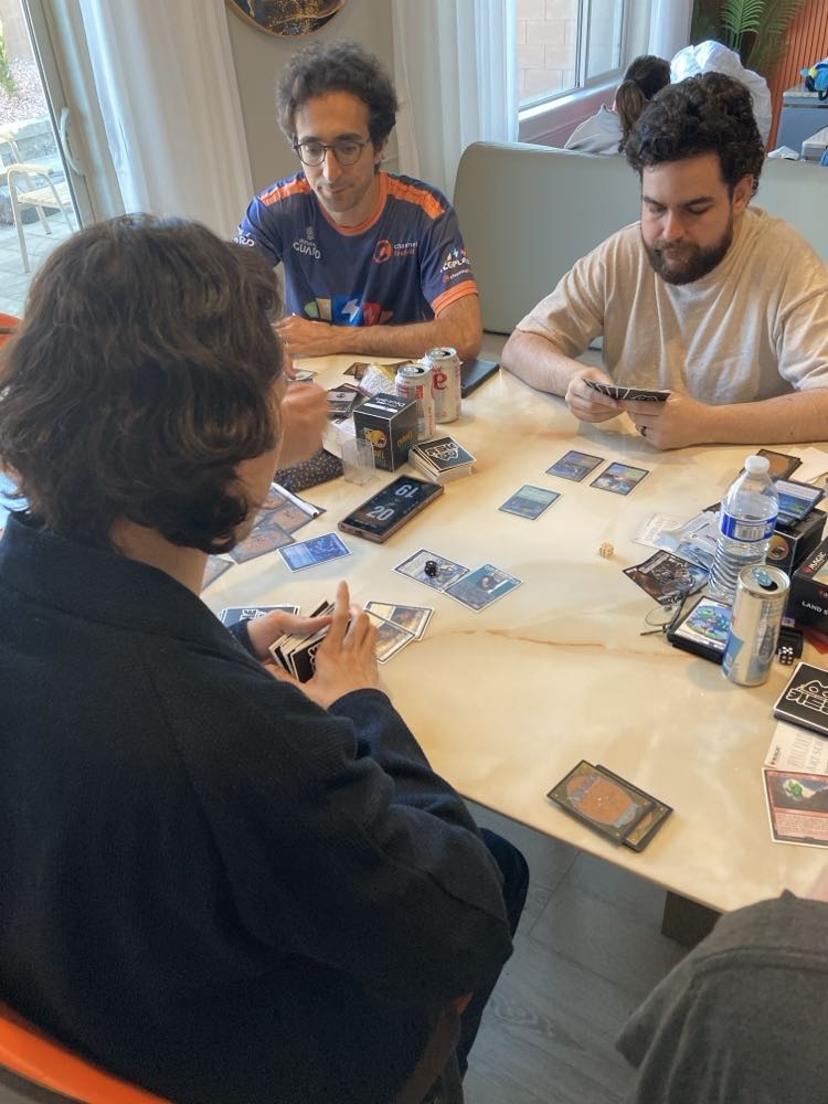 Team Photo with Reid Duke playing Magic: The Gathering